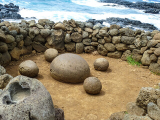 Fototapeta na wymiar Ahu Te Pito Kura on Easter Island. Ancient place against Blue ocean, Chile, South America
