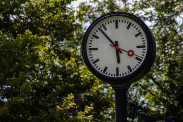 Classic black and white analog clocks with synchronized time show teamwork and synced project...