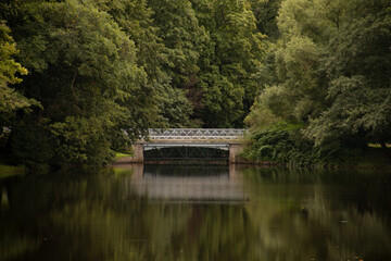 Obraz premium White-stone bridge in the fairy tale park. Saint Petersburg, Russia, 2020