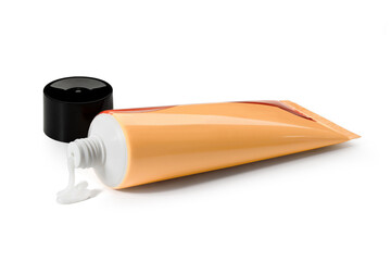 Cream, yellow tube of ointment on a white background. View from above. Full depth of field. With clipping path