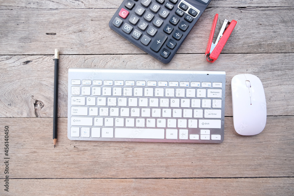 Poster top view on working space with office equipment and keyboard on table background