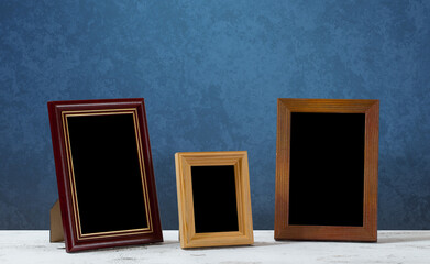 frames on table, blue wall