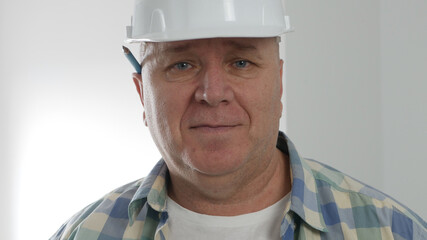 Portrait with an Engineer Wearing Helmet and Smiling Happy.