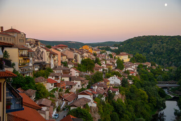 Obraz premium Houses with red tiled roofs , built on a mountain .