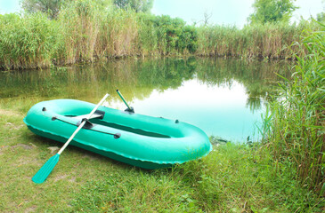 Inflatable boat on the lake in the morning. 