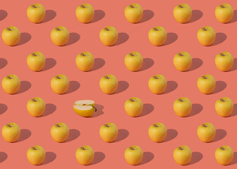 pattern of juicy yellow apples on a pink background