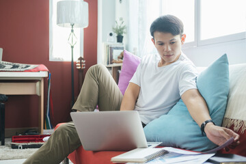 Young man online working and learning from home