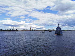 View from the bridge of a warship and sailboats in the Neva water area for the Day of the Navy in...