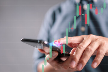 Stock trading concept with person holding a smartphone