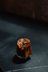 iced coffee served on black table at cafe​