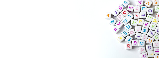 A lot of white cubes with letters on a white background. Copy Space. © beast01