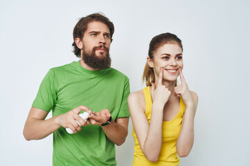 man and woman in the bathroom personal care morning hygiene