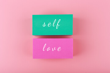 Trendy minimal self love creative concept in pink colors. Mental health, self acceptance, self care and respect or being single concept.