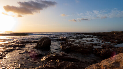 sunset on the rocks of the coast