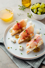chic appetizer with pear and prosciutto