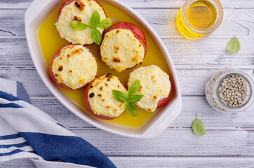 Stewed tomatoes stuffed with cheese