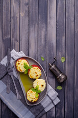 Stewed tomatoes stuffed with cheese