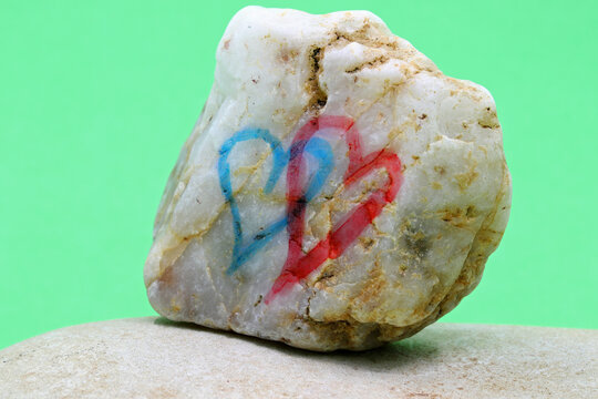 colorful heart shape drawn on stone
