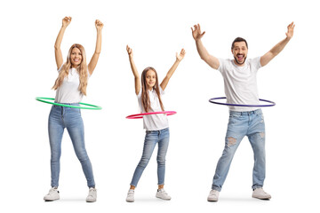 Obraz premium Family of a mother, father and daughter spinning hula hoops