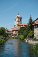View of the bell tower and the river in Aguilar de Campoo, Palencia, Spain.