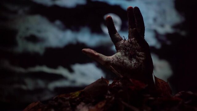 Zombie hand coming out of the ground