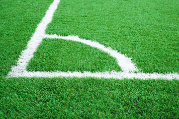 Artificial grass of football field with white stripe, Soccer corner line detail, Green astro turf...
