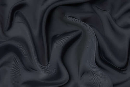 Premium Photo, Black fabric texture background, wavy fabric slippery black  color, luxury satin cloth text