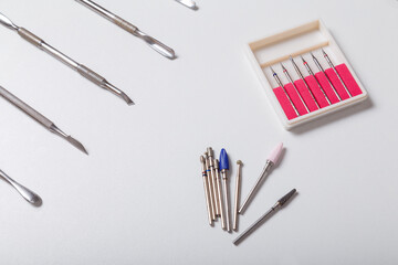 Set of disinfected manicure or pedicure tools. Cuticle pushers, cutters set and tweezers for safe...