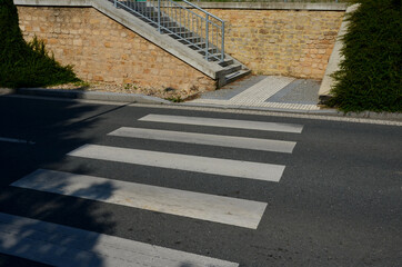 better safety, the cities are equipped with posts on the edge of the sidewalk with chain railing....
