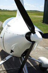 Close up of black propeller on  gyrocopter parked at airfield