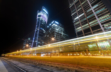 Warsaw traffic by night, modern city, business center