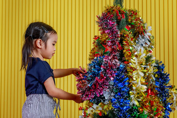 Little girl and Christmas tree