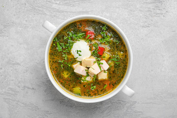 Overhead view of vegetable soup with chicken fillet