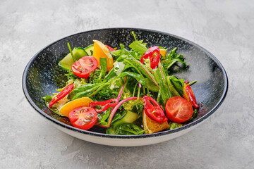 Spicy salad with orange, chilli, tomato, cucumber and avocado
