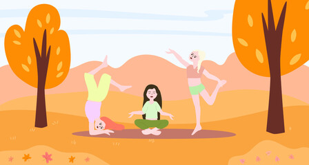 Girls, women doing yoga in the autumn park. Meditation in nature.