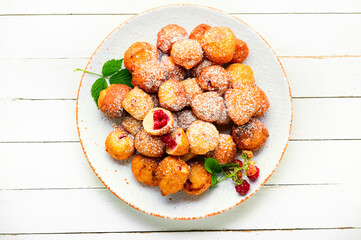 Curd donuts with raspberries