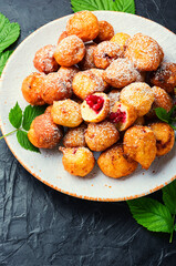 Curd donuts with raspberries