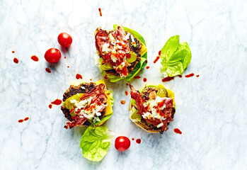 Home made Hamburger with bacon and hot Thai Sriracha Sauce