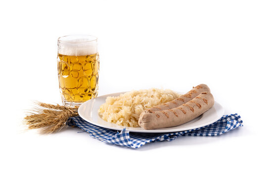 Bratwurst sausage ,sauerkraut, pretzels and beer isolated on white background. Typical german food	