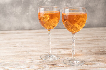 Homemade Aperol spritz. Orange cocktails on wooden table. Simple Aperol Spritz Recipe. Aperol spritz in a glass with ice