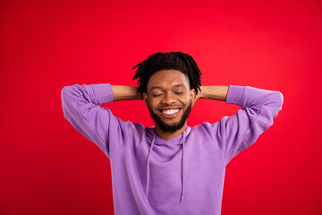 Portrait of attractive cheerful dreamy brunet guy resting nap slumber isolated over bright red color background