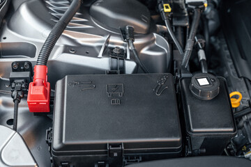 Fototapeta premium Battery car engine detail - close up of machine new batteries.