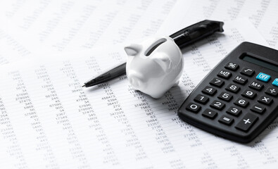 Finance And Business Concept - Pen, Calculator & Piggy Bank