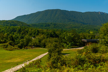 OKATSE, GEORGIA: A beautiful scenic road that leads to Okatse Canyon on a sunny summer day.