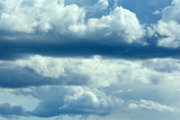 Large dark clouds before the start of rain and thunderstorms, with part of the blue sky