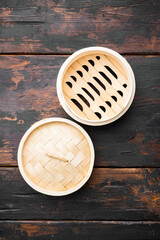 Empty Bamboo Steamer, with copy space for text or food, with copy space for text or food, top view flat lay , on old dark  wooden table background