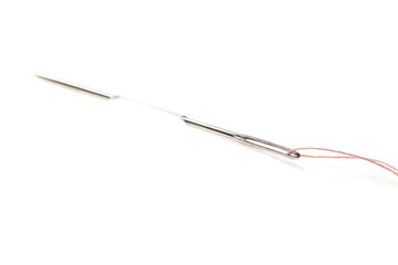 Sewing needle with thread piercing white paper
