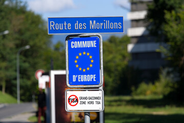 Blue traffic sign of European community Le Grand-Saconnex at City of Geneva on a sunny summer...