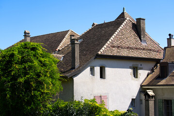 Apartment houses at the old town of Nyon on a sunny summer day. Photo taken August 28th, 2021, Nyon, Switzerland.