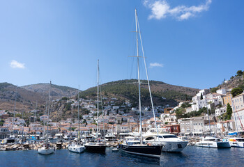 Fototapeta na wymiar July, 20, 2021. Hydra Island, Greece. View of the bay, ships and attractions of the island of Hydra